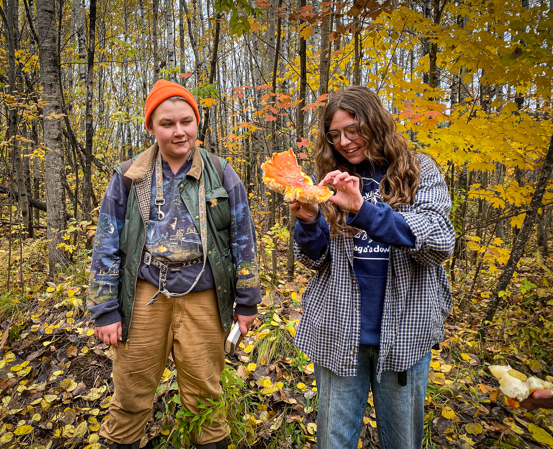 2 people looking at the plant